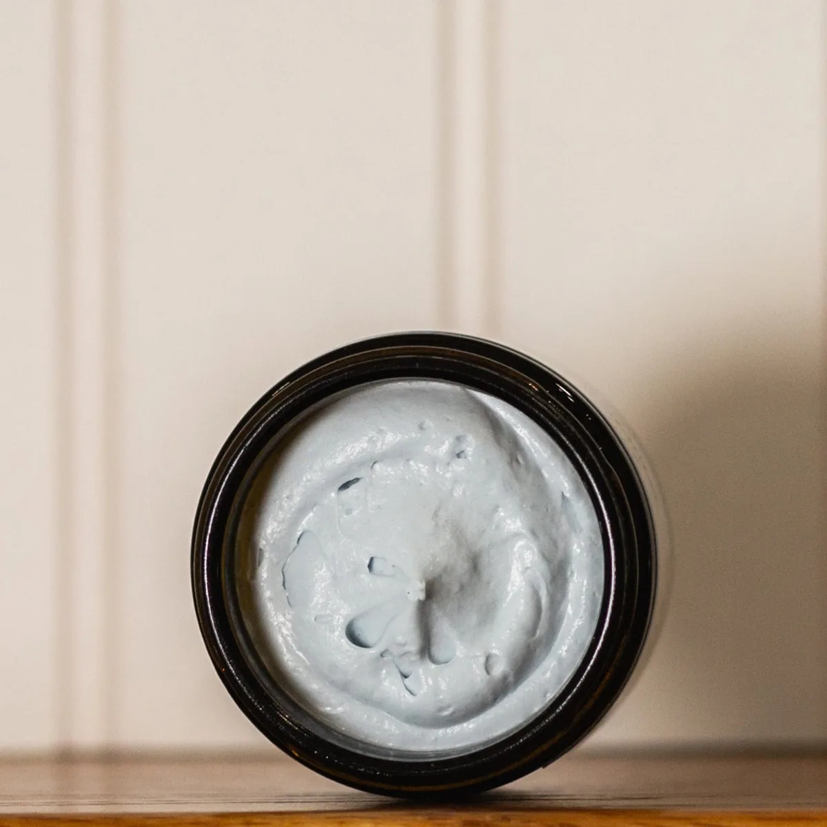 Open jar of HydroTallow whipped tallow showing its silky texture